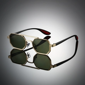 Detailed close-up of hexagonal gold metal frames with dark green lenses and black temples