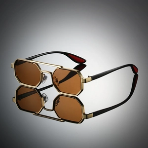 Macro detail of golden hexagonal metal frame sunglasses with double bridge and brown lenses
