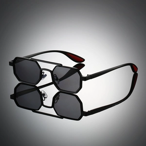 Detail of black hexagonal metal sunglasses featuring a double bridge and dark lenses
