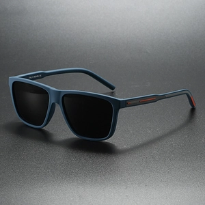 Close-up of matte navy square sunglasses with red stripe detail and grey lenses