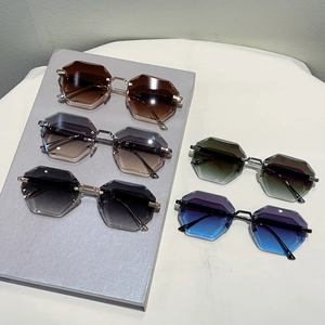 Multiple pairs of frameless hexagonal sunglasses with gradient lenses and metal frames