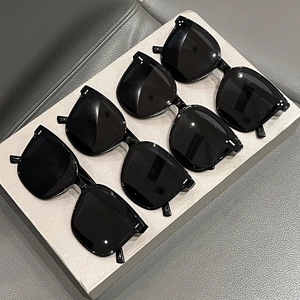 Three pairs of classic black oversized cat-eye sunglasses with triple rivet decor