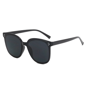 Classic black cat-eye sunglasses with three-point silver metal dots on a glossy frame