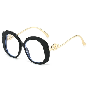 Black wavy leopard print eyeglasses with gold heart-shaped metal temples and anti-blue lens