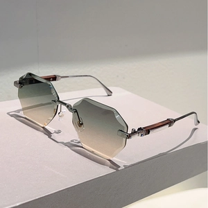 Detail of rimless hexagonal gradient lenses with diamond cut edges and wood temples