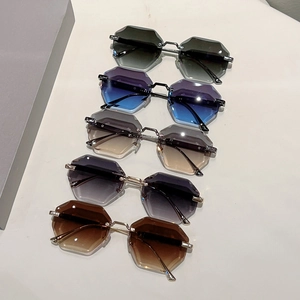 Frameless hexagonal diamond-cut sunglasses with gradient lenses and metal frames