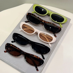 Retro oval narrow sunglasses in black, white, tortoise and green shown in a group display