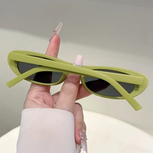 Detail view of oval avocado green sunglasses frames with matte finish and black lenses