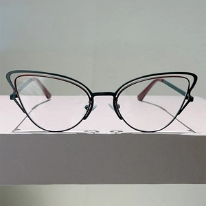Cat eye glasses with black and red bicolor metal frame and transparent lenses