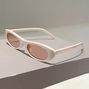 Detailed side view of vintage oval sunglasses with cream frame on a display block