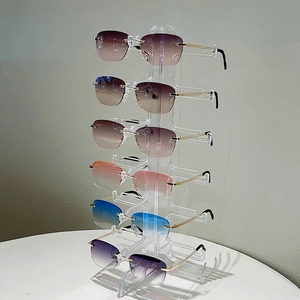 Occhiali da sole ovali senza montatura in 6 colori su supporto in acrilico a 6 livelli