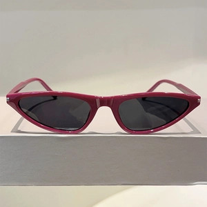 Chic magenta Y2K cat eye sunglasses with dark lenses and silver metal accents