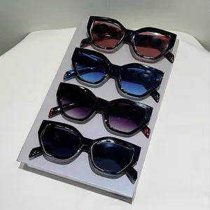Detailed comparison of cat-eye sunglasses in red, blue, purple, and dark grey lenses