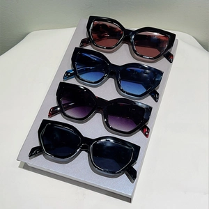 Polygon cat eye sunglasses set with thick black frames and colorful gradient lenses