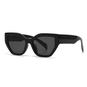 Chic black oversized cat-eye sunglasses with geometric thick frames and dark lenses