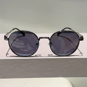 Classic round metal sunglasses for men with dark polarized lenses and a gunmetal frame