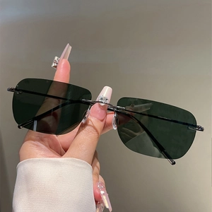 Detail of rimless polarized sunglasses with heart rhinestone bridge and metal frame