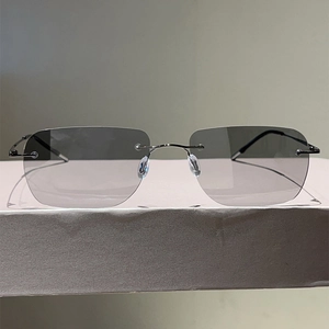 Ultralight frameless polarized sunglasses with gradient grey lenses and slim metal temples