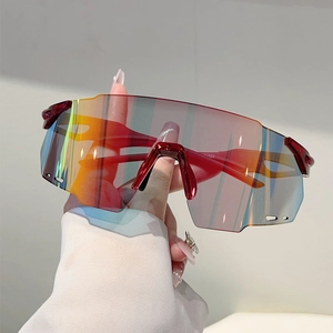 Sporty wraparound sunglasses with oversized rainbow mirrored lens and red frame for cycling