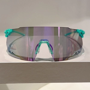 Teal cycling sunglasses with purple iridescent lens and ventilated frame for sports
