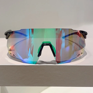 Detail of colorful mirrored lens and streamlined black frame on sports sunglasses