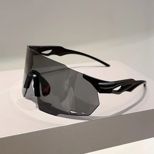 Side view of matte black sports sunglasses with wide gray lenses and aerodynamic hollow temples