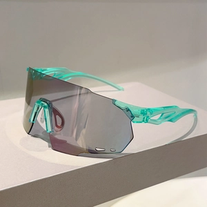 Detail view of teal translucent sports sunglasses with large grey single-piece lens