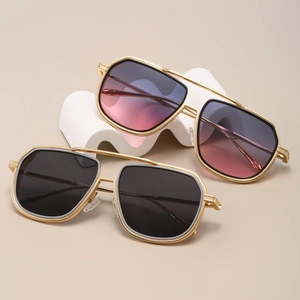 Close-up of retro square metal sunglasses with dark gray and pink purple gradient lenses