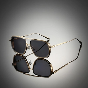 Retro square gold metal sunglasses with double bridge and dark lenses on grey background