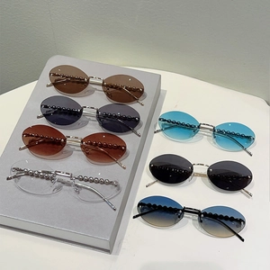 Collection of rimless oval sunglasses with metallic frames and pearl bead temple accents