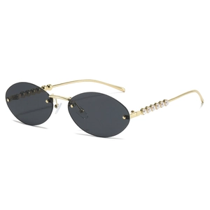 Luxury rimless oval sunglasses with gold temples and elegant white pearl decoration