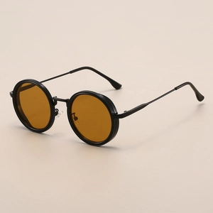 Retro round black frame sunglasses with vibrant orange lenses shown in a top-down view
