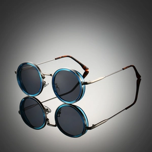 Vintage round dual-color frame sunglasses with blue outer ring and metallic silver temples