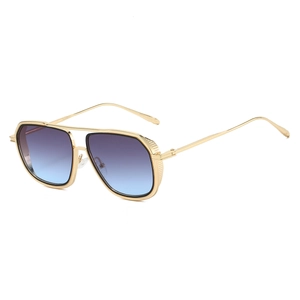 Detail of vintage aviator sunglasses with gold metal frame and gradient purple lenses