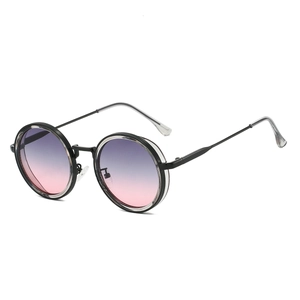 Detail view of round retro sunglasses featuring purple gradient lenses and black frames