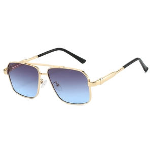 Detail of aviator sunglasses with gold metal double bridge and purple gradient lenses