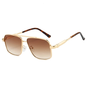 Detail view of aviator sunglasses with gold double bridge and brown gradient lenses