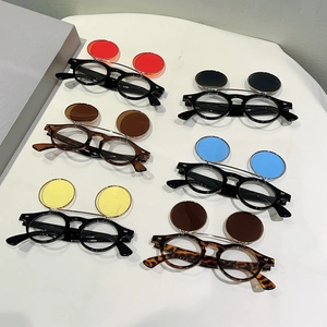 Retro flip-up round sunglasses with metal studs and various colored lenses in 45-degree view