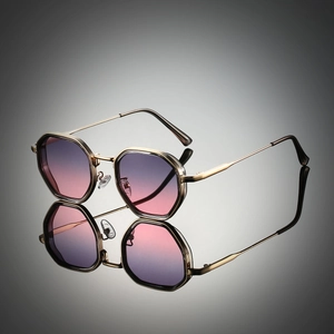 Detail of octagonal metal frames and purple gradient lenses with mirror reflection