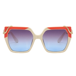 Detail of square sunglasses with gold snake metal accent and gradient blue-purple lenses