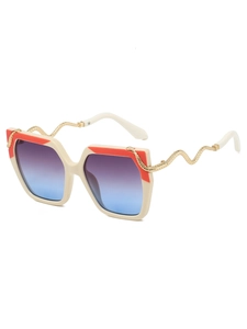 Detail of square sunglasses with gradient lenses and unique golden snake-shaped metal temples