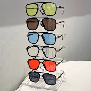 Close-up of retro double-bridge sunglasses set in various colorful resin lenses