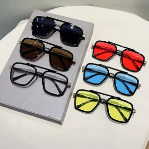 Detailed view of square double-bridge sunglasses in multiple colors with gold metal accents