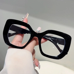 Detailed view of black thick frame cat-eye glasses with model number M6252 engraving