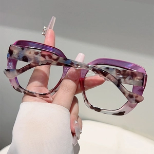 Detailed view of purple gradient and leopard print large frame cat-eye glasses