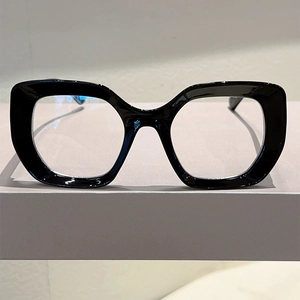 Close-up of thick black cat-eye frame glasses showing polished texture and sturdy design