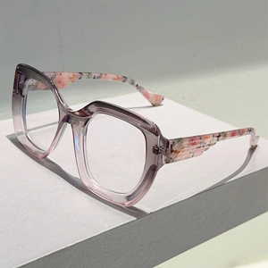 Detailed side view of cat eye glasses with lavender frames and floral patterned temples