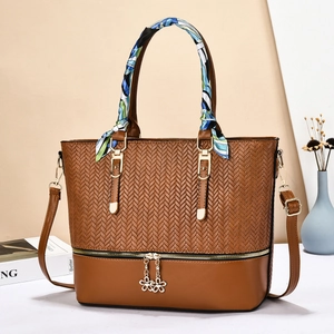Brown leather tote bag with woven texture and floral scarf handle for women