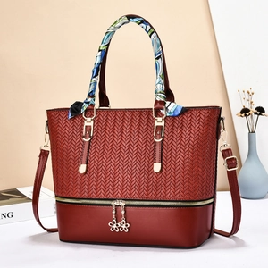 Deep red minimalist tote bag with woven texture, scarf handle and adjustable strap