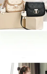 Detail of mini saddle bag featuring gold T-buckle and monogram leather with plush pendant